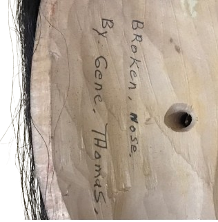 False Face. “Broken nose” by Gene Thomas. Dark red, copper eyes